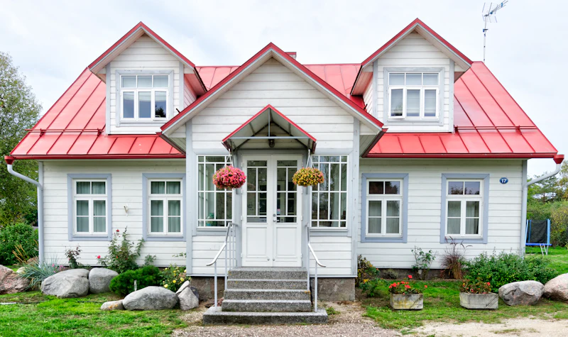 Clapboard house with symmetrical windows and double front doors