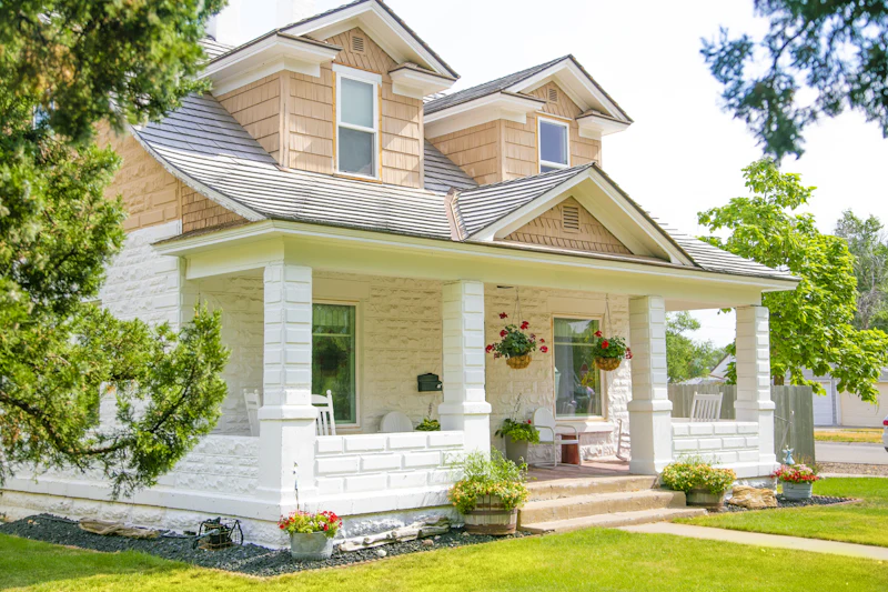 Craftsman-style home with a wide covered porch and tapered columns