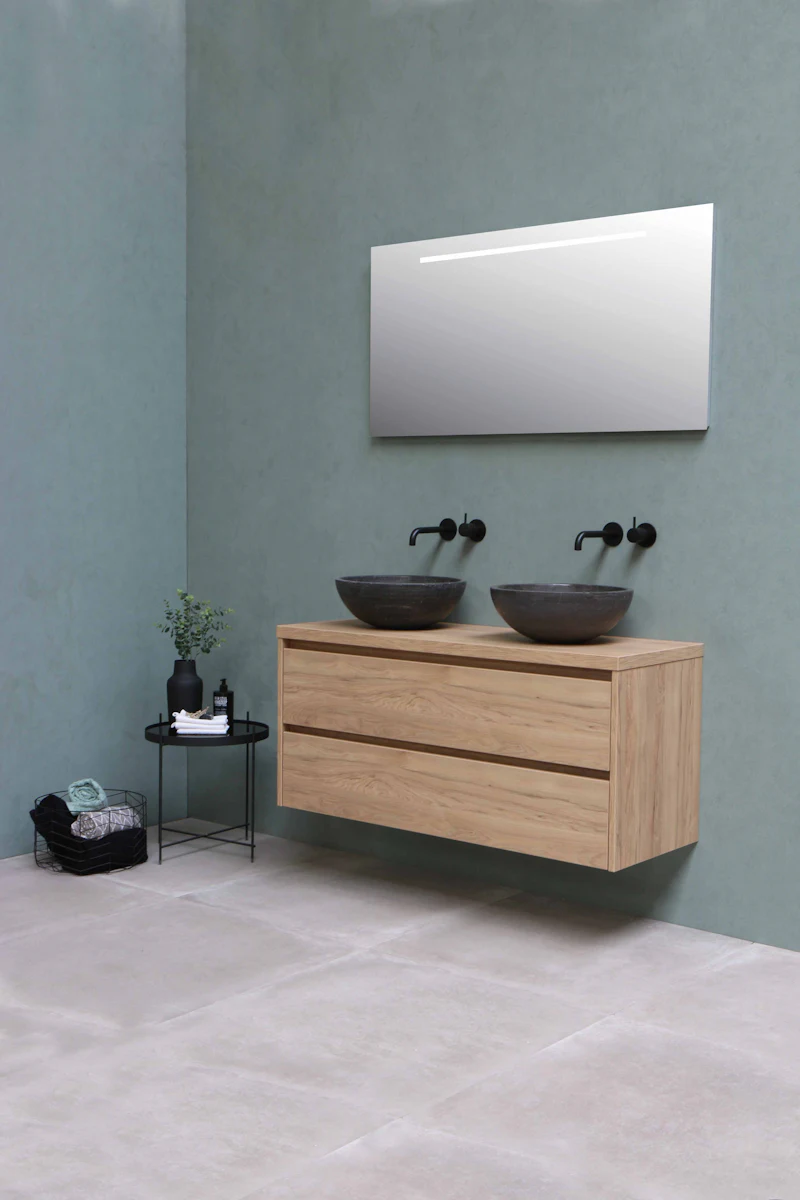 Wood floating vanity with two vessel sinks against a gray wall